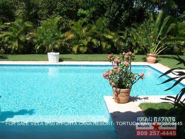 Puntacana resort Villa for sale in Tortuga Bay with garden view and swimming pool.  This Villa number B-50 has 3 Bedrooms, 400 m2 of construction (4306 sq. ft.) and it has 1000 m2 of land lot.  Tortuga Bay is close to La Cana Golf and Beach club, on the first nine holes.  Asking price for Puntacana resort Villa for sale in Tortuga Bay is $825,000  Puntacana resort Villa for sale in Tortuga Bay is 100% finished, it has a service room, Villa comes furnished and has parking for two cars.  Puntacana resort Villa for sale in Tortuga Bay
