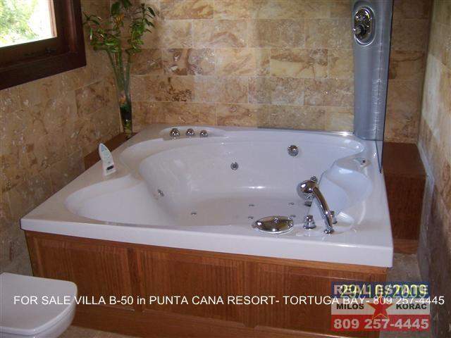 Puntacana resort Villa for sale in Tortuga Bay with garden view and swimming pool.  This Villa number B-50 has 3 Bedrooms, 400 m2 of construction (4306 sq. ft.) and it has 1000 m2 of land lot.  Tortuga Bay is close to La Cana Golf and Beach club, on the first nine holes.  Asking price for Puntacana resort Villa for sale in Tortuga Bay is $825,000  Puntacana resort Villa for sale in Tortuga Bay is 100% finished, it has a service room, Villa comes furnished and has parking for two cars.  Puntacana resort Villa for sale in Tortuga Bay